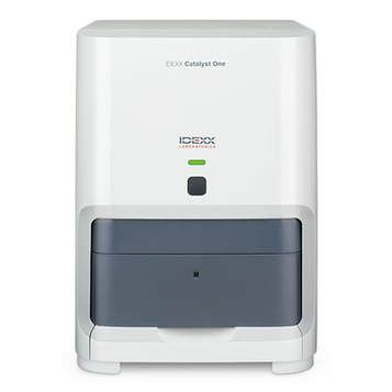 White and gray lab analyzer with a dark front compartment and small display lights