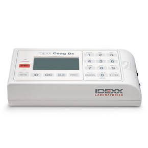 White laboratory blood glucose meter with display and keypad