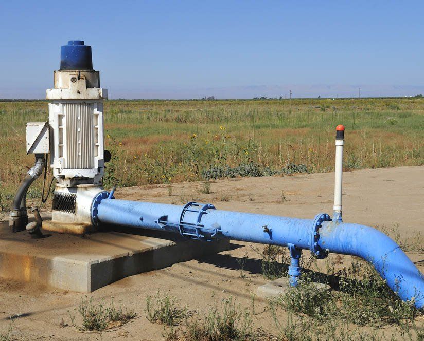 Water Pump in Canal — Irrigation Supplies in Yeppoon, QLD