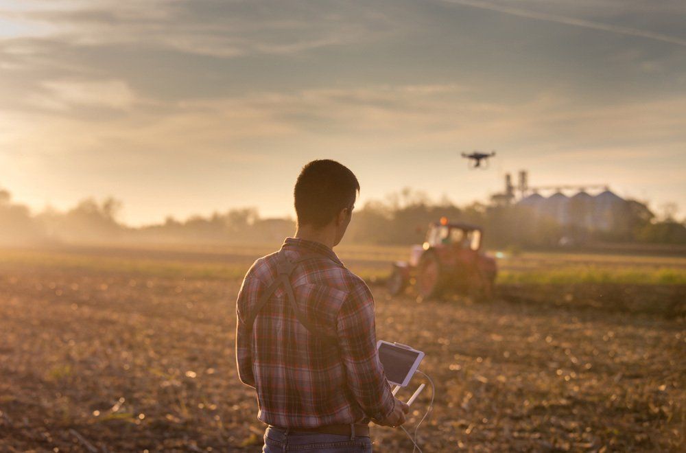 Farmer Using Irrigation Controller — Irrigation Supplies in Yeppoon, QLD