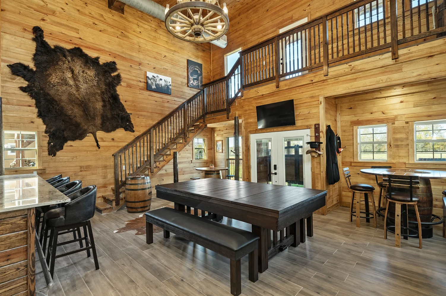 There is a pool table in the middle of the room.