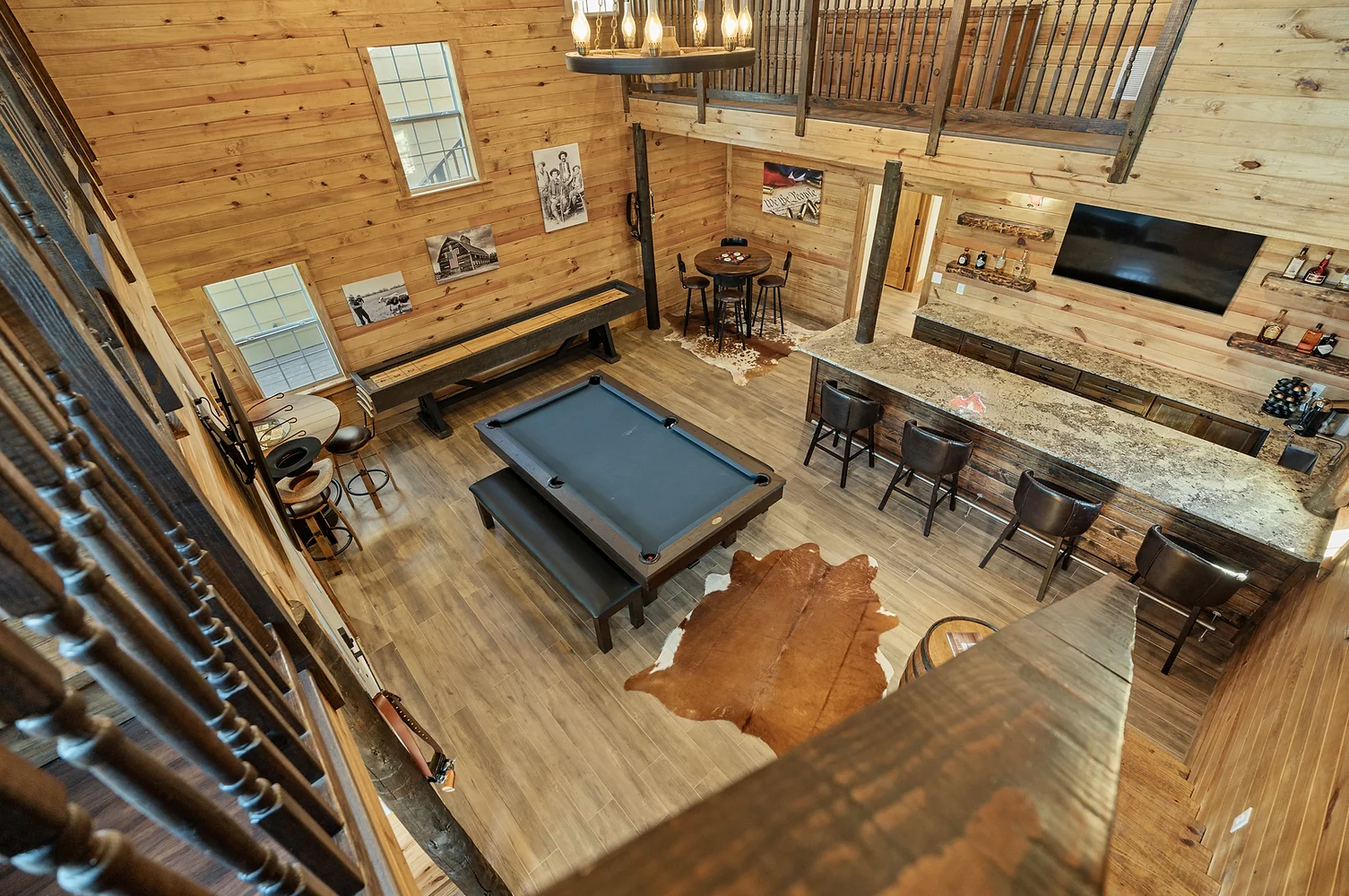 There is a pool table in the middle of the room.