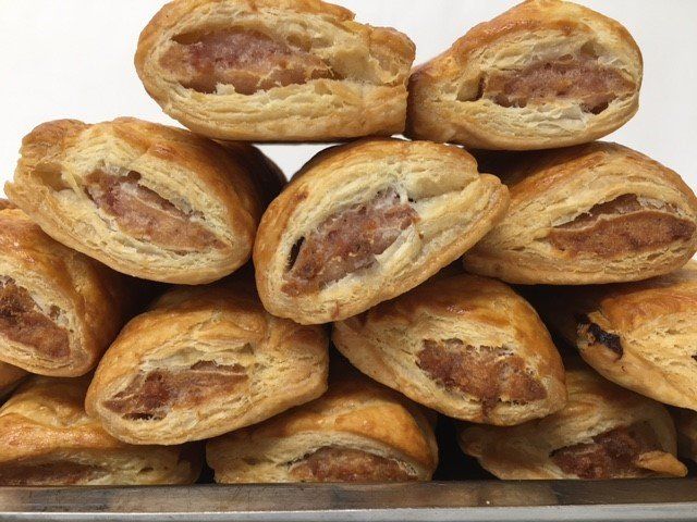 A bunch of pastries are stacked on top of each other