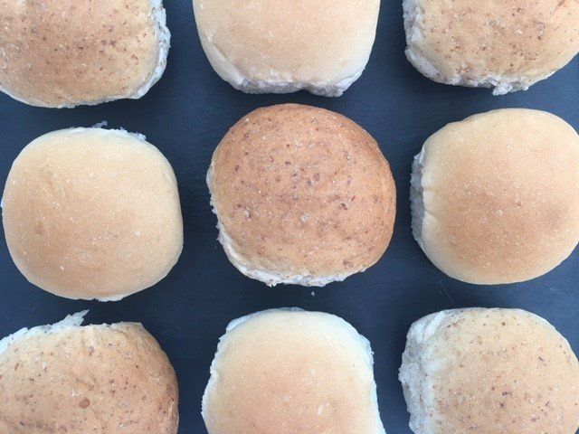 A bunch of different types of bread on a table