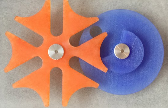 A close up of a blue and orange gear