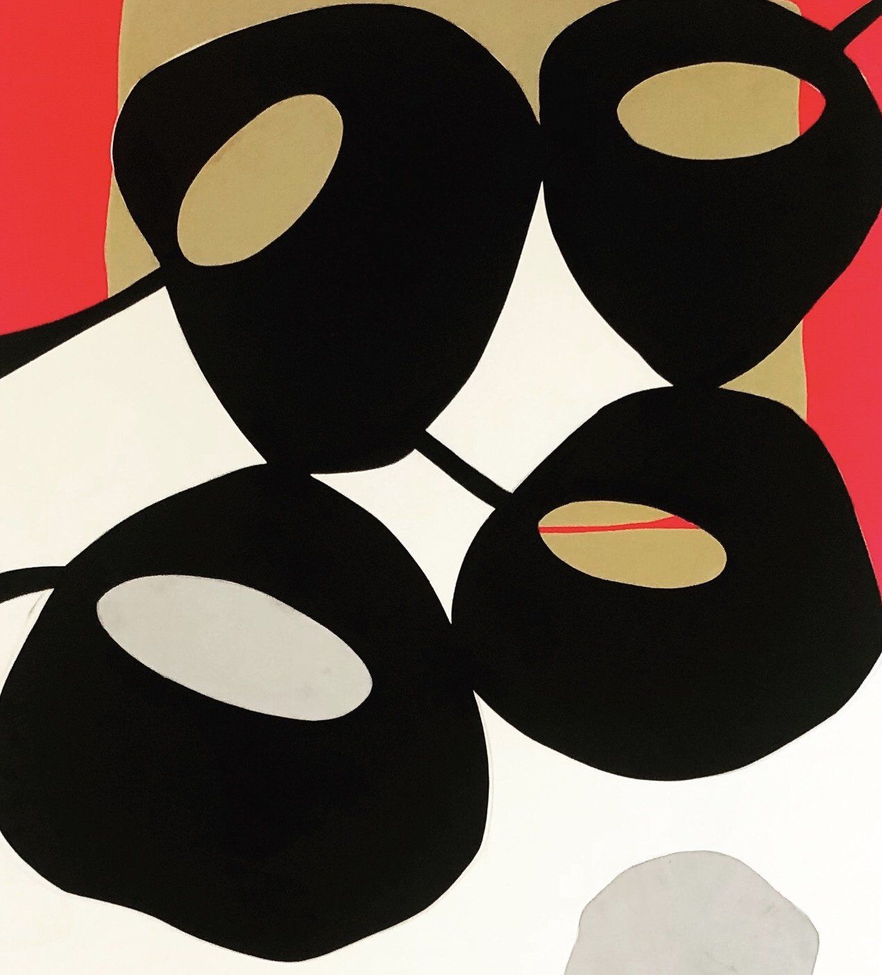 A drawing of three black circles on a red and white background