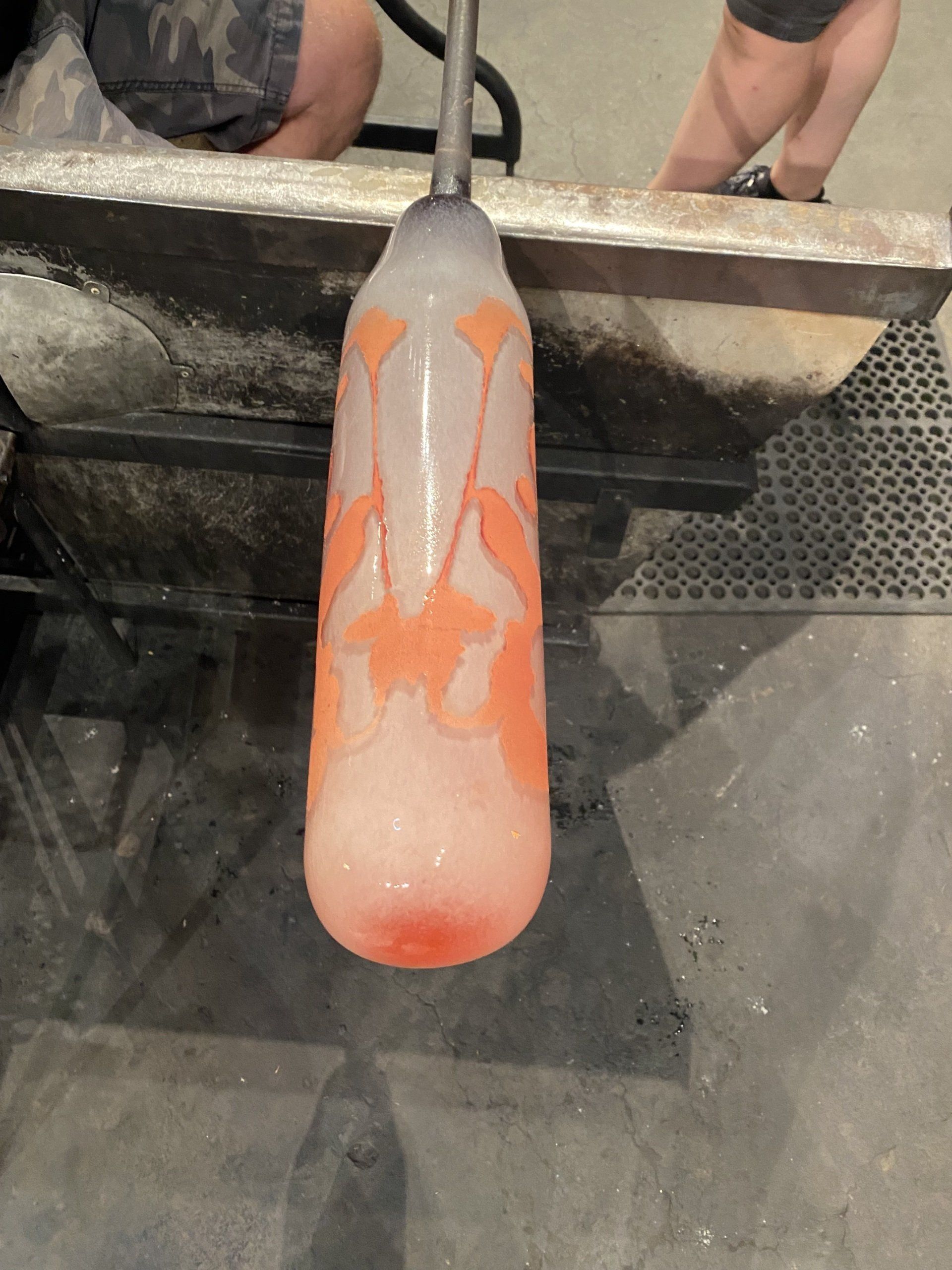 A glass bottle with a starfish design on it