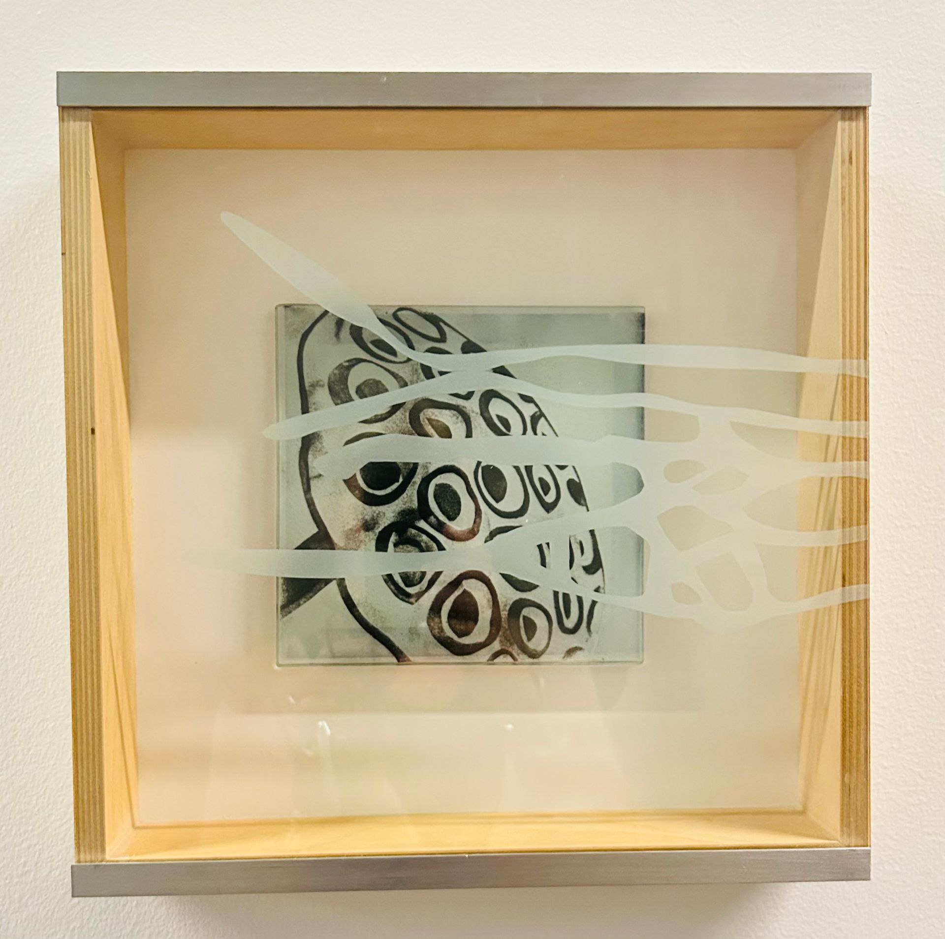 A picture in a wooden frame that says ' you ' on it