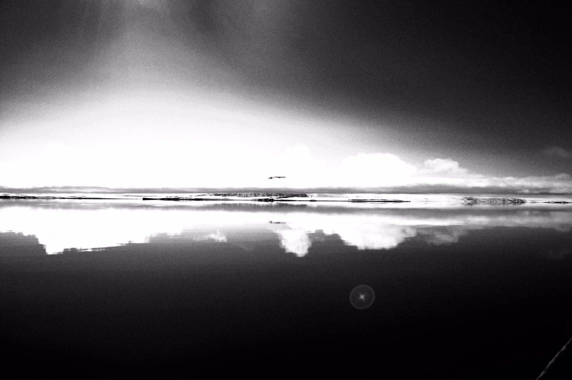 A black and white photo of a body of water