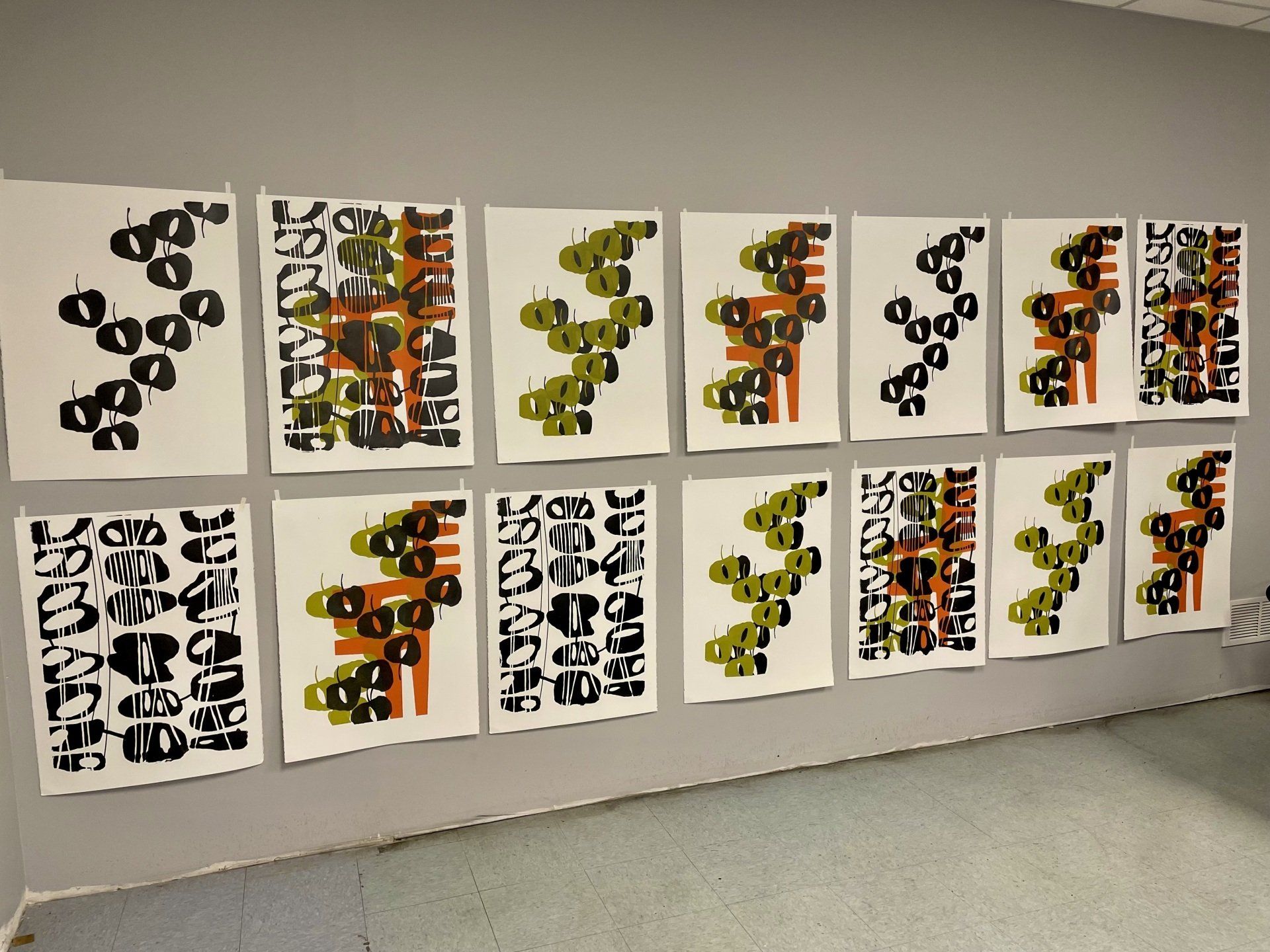 A row of posters on a wall including one that says ' i love you '