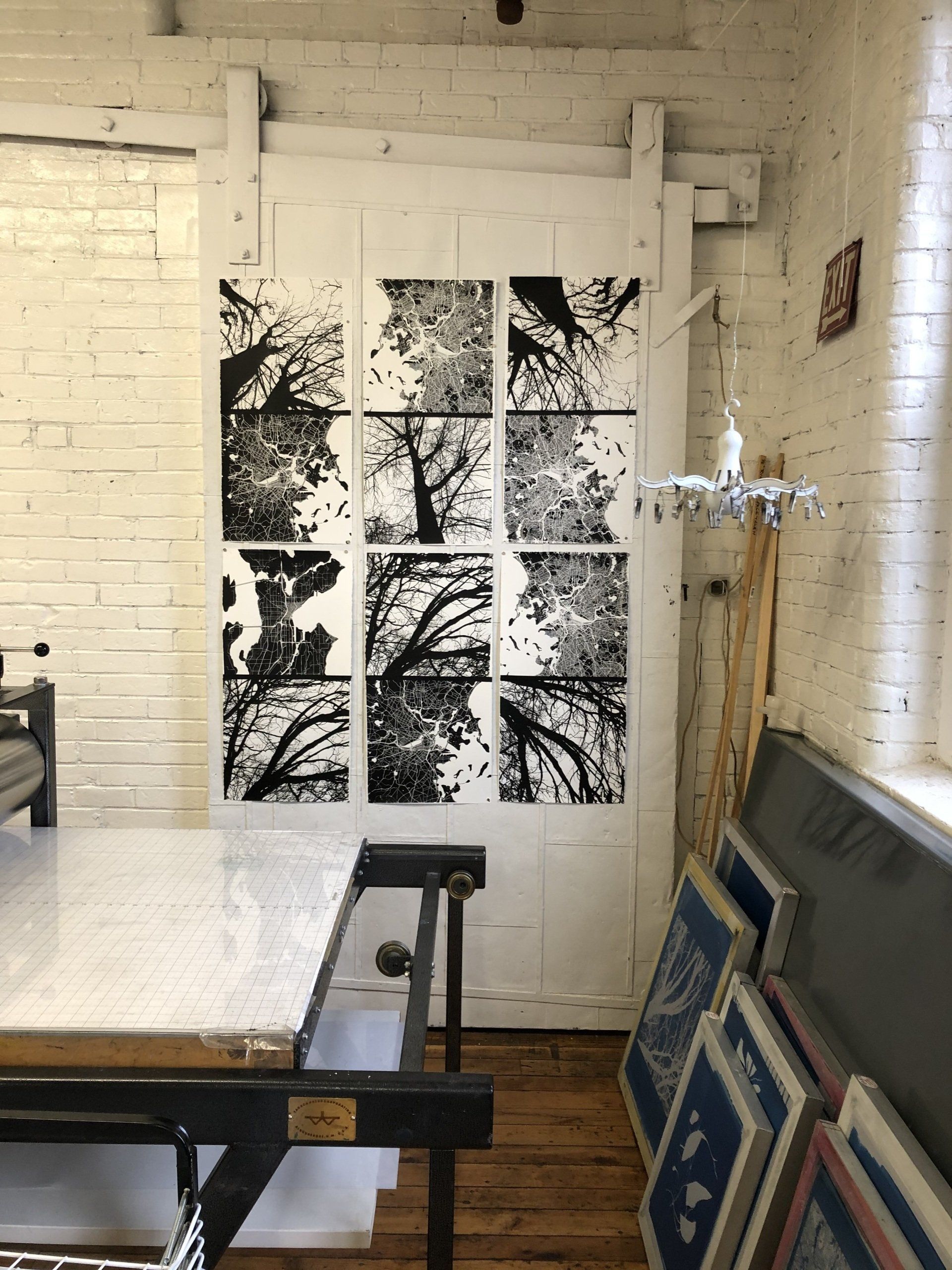 A room with a sliding glass door with a picture of trees on it