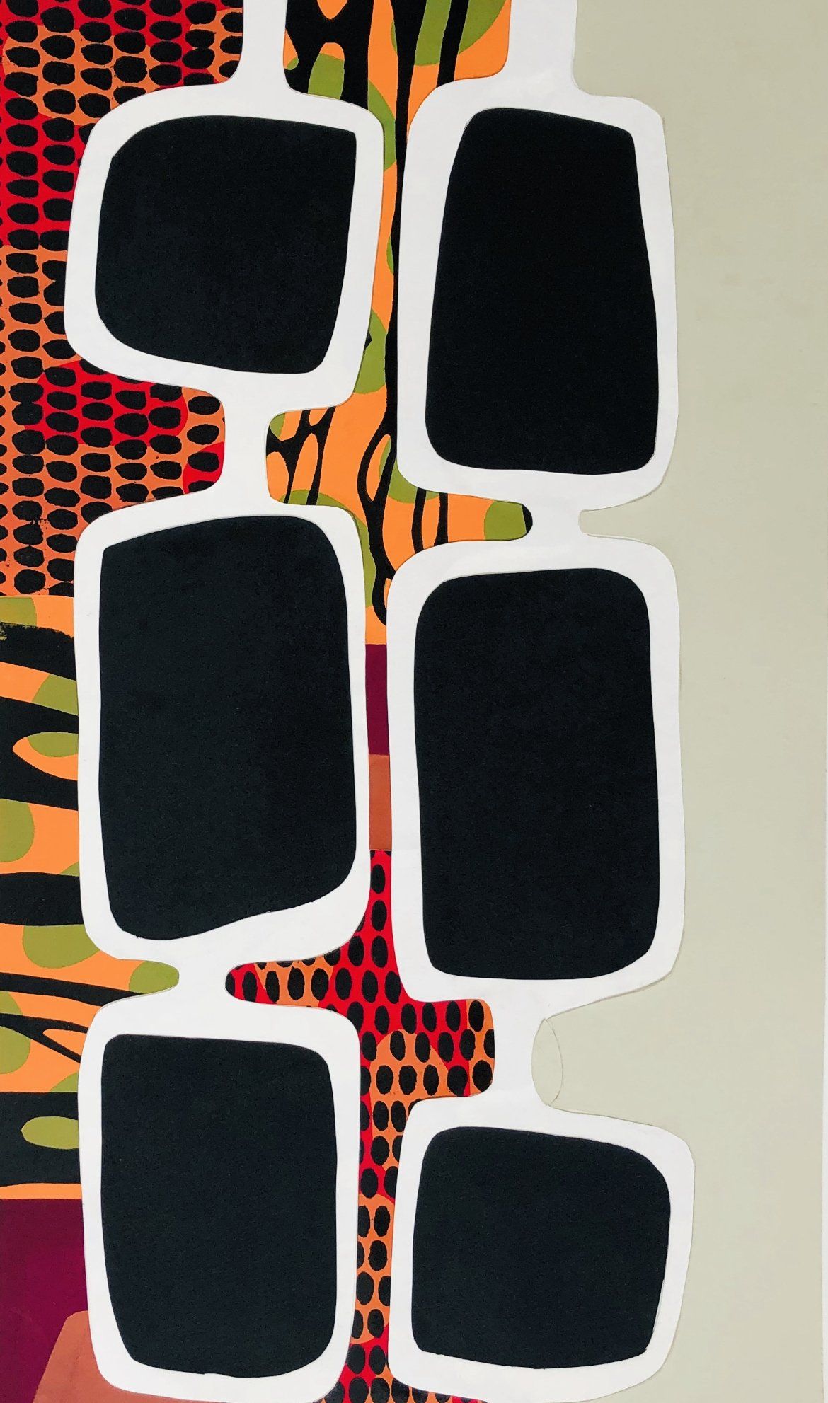 A colorful rug with black squares and white lines