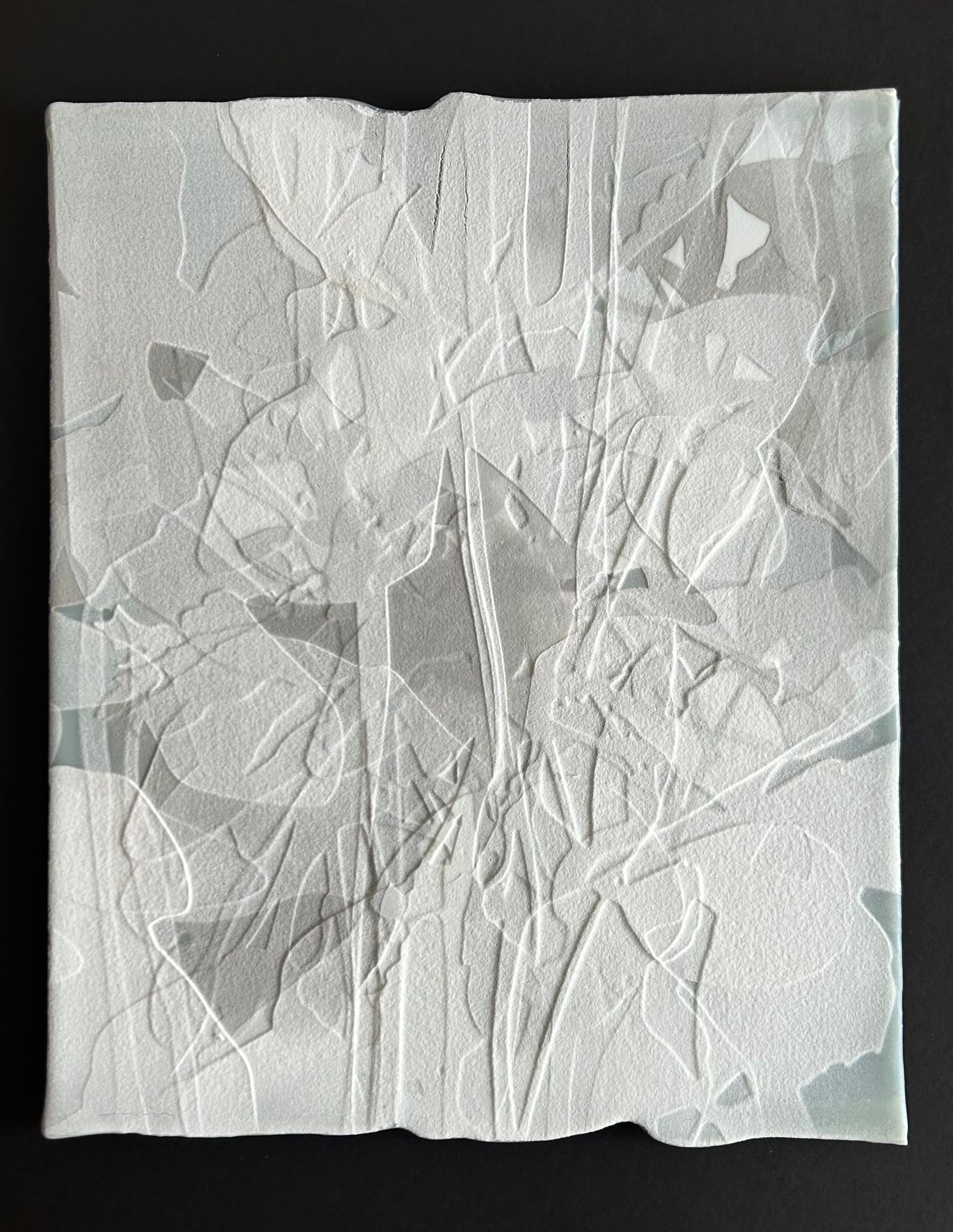 A piece of white paper with a geometric pattern on it