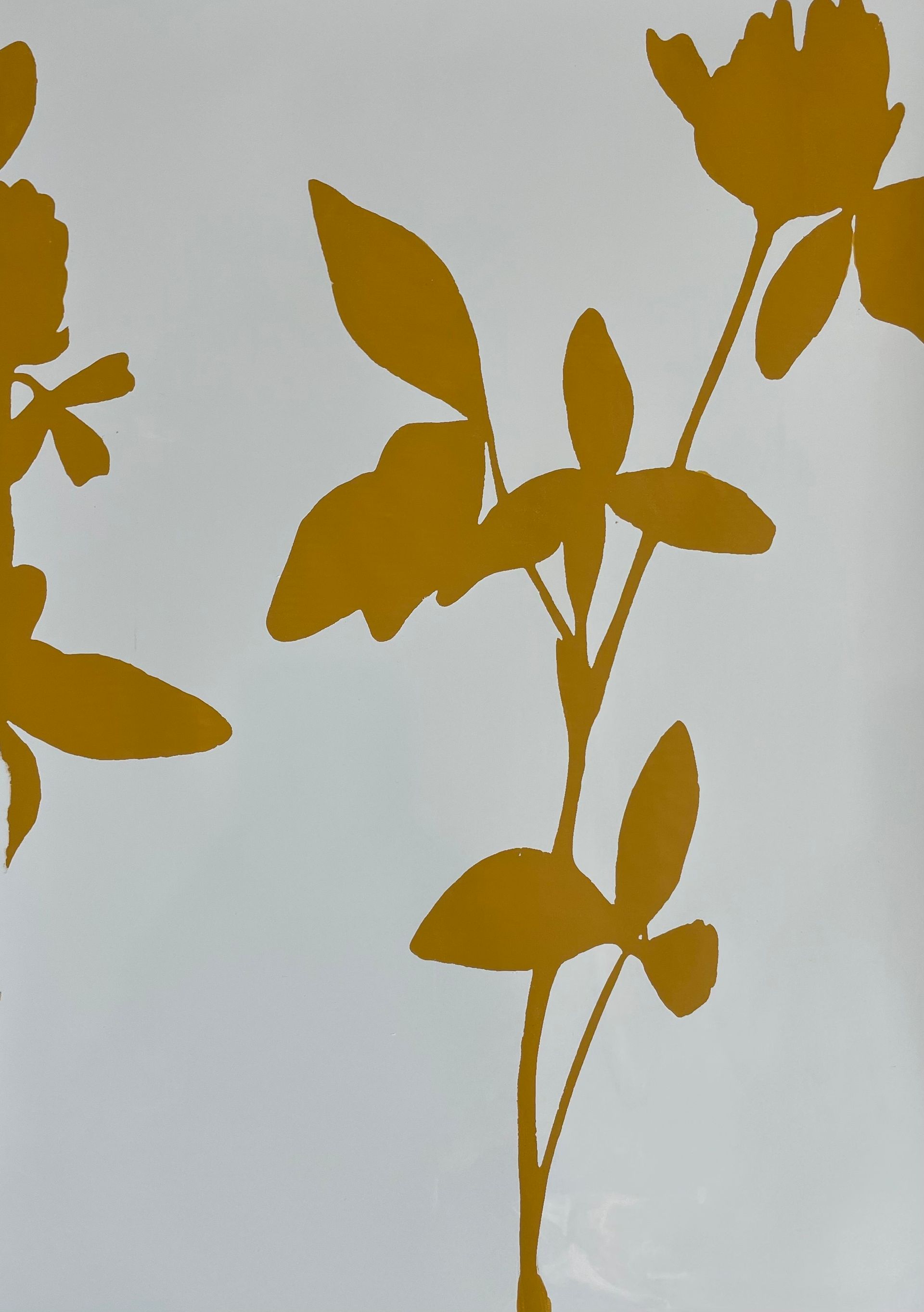 A white background with gold flowers and leaves on it