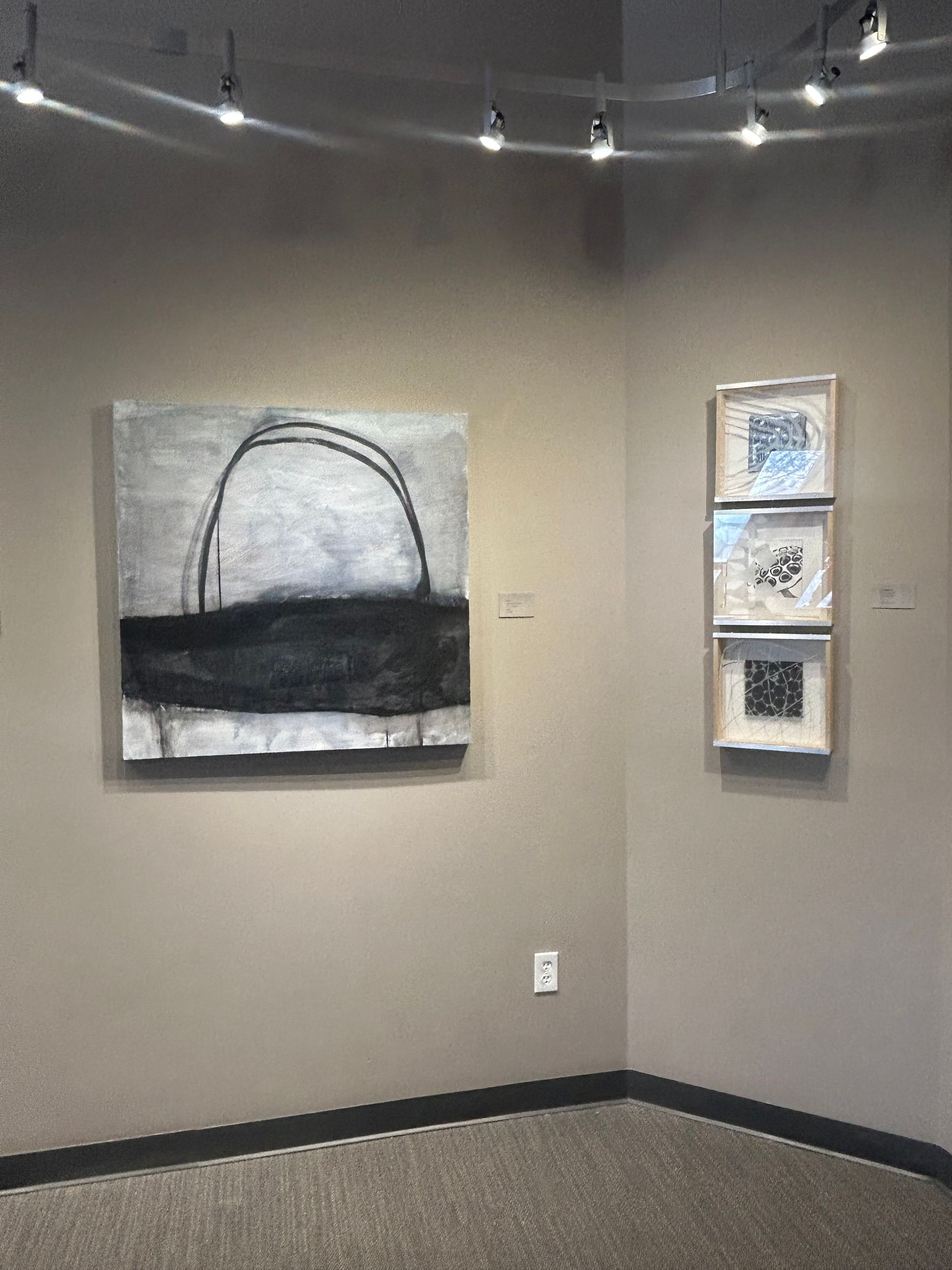 A painting of yellow and black leaves on a white background