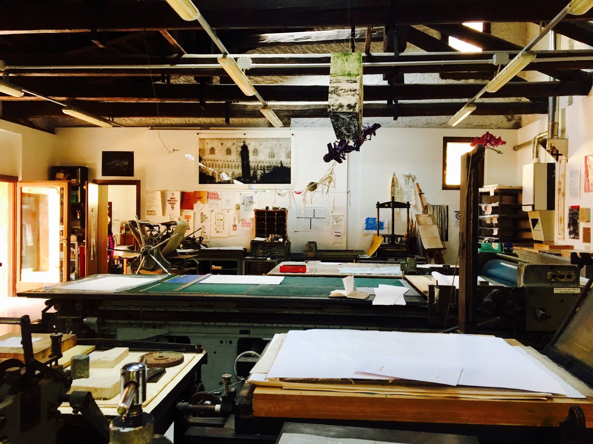 A large room with a lot of tables and machinery