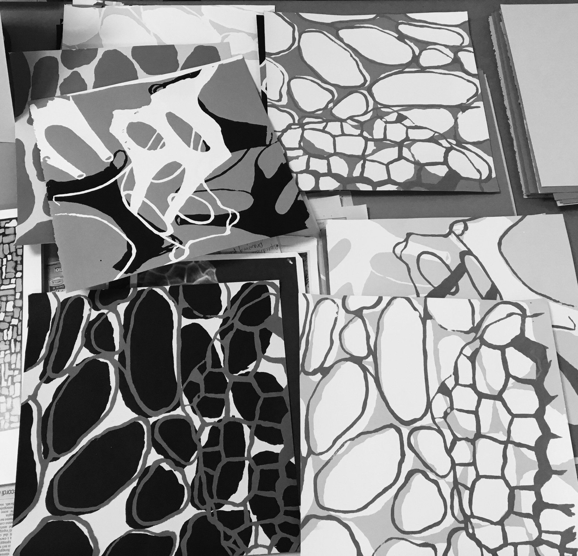 A black and white painting with a geometric pattern