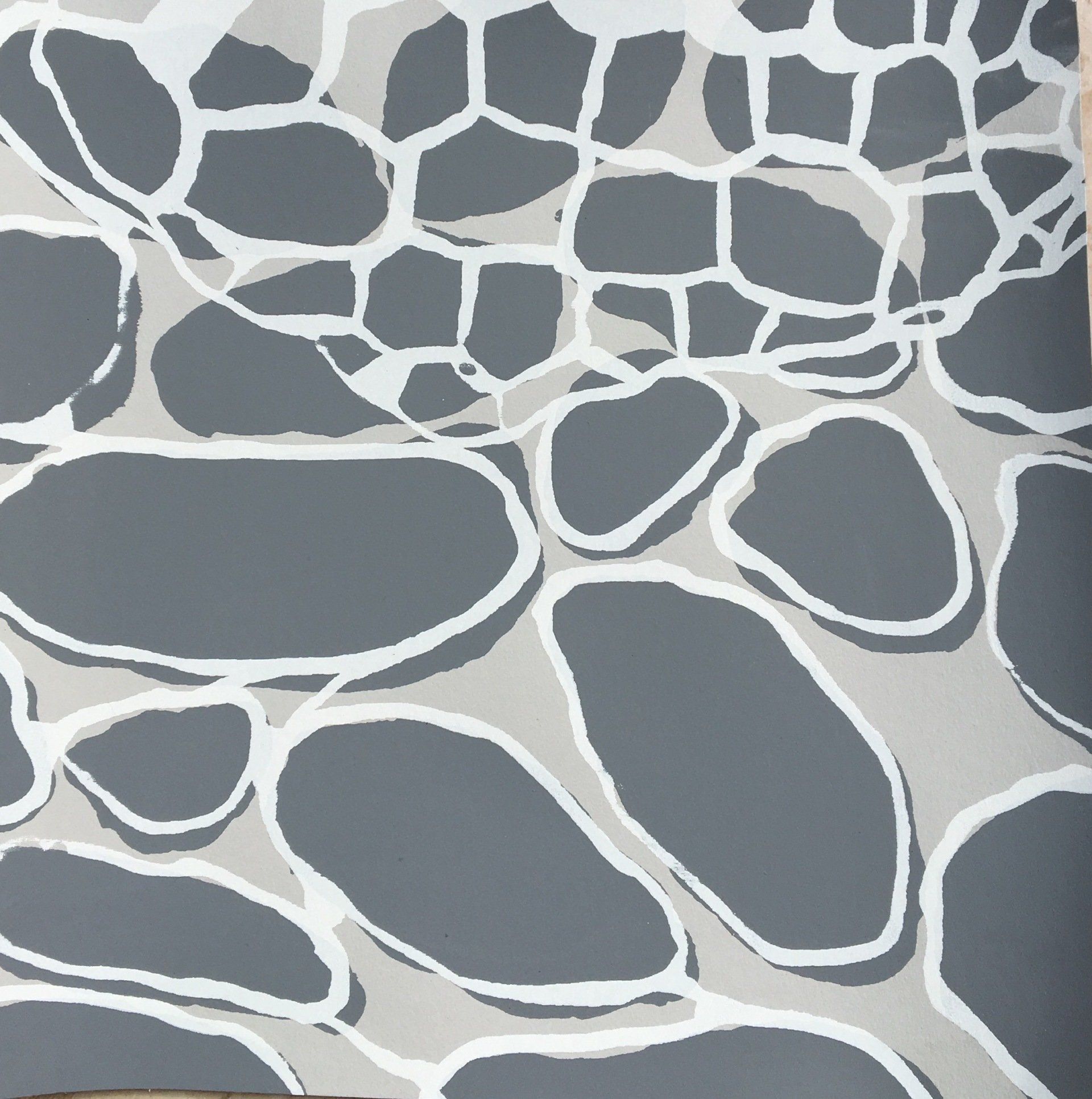 A close up of a gray and white pattern on a wall