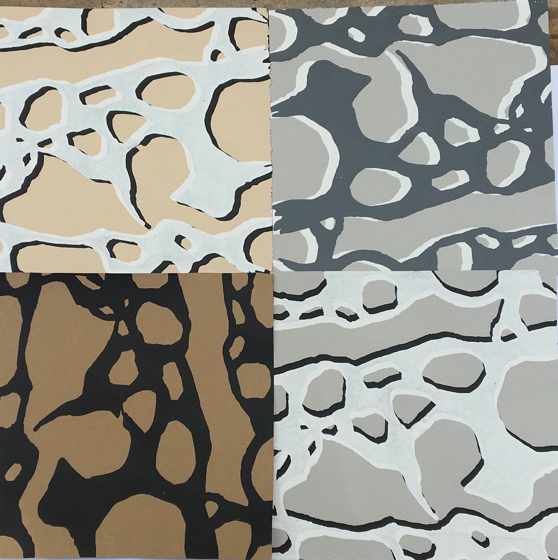 Four pieces of paper with different patterns on them