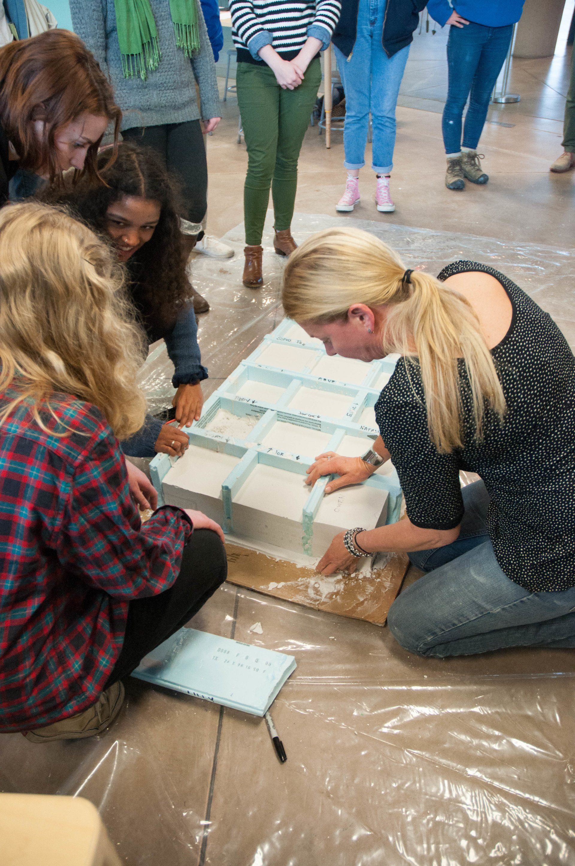 A group of women are working on a project together