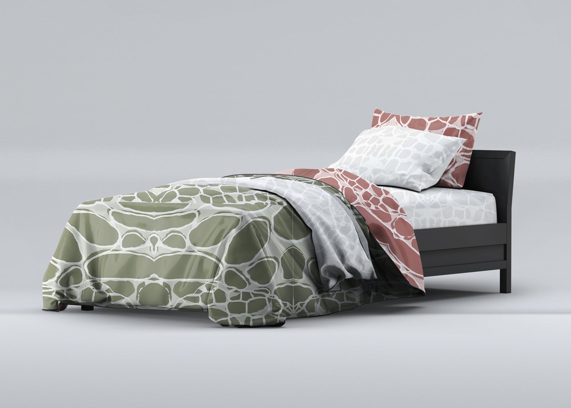 A bed with a patterned comforter and pillows on it