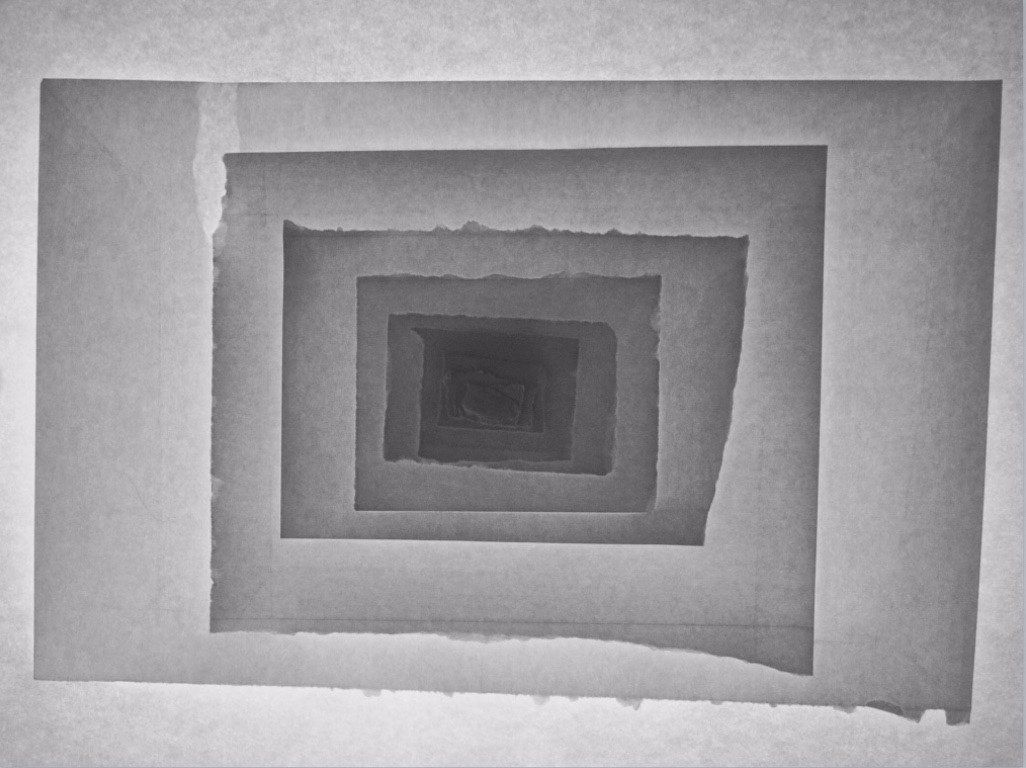 A black and white photo of a maze of squares