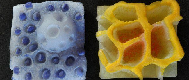 A piece of soap with blue dots and a piece of soap with yellow dots