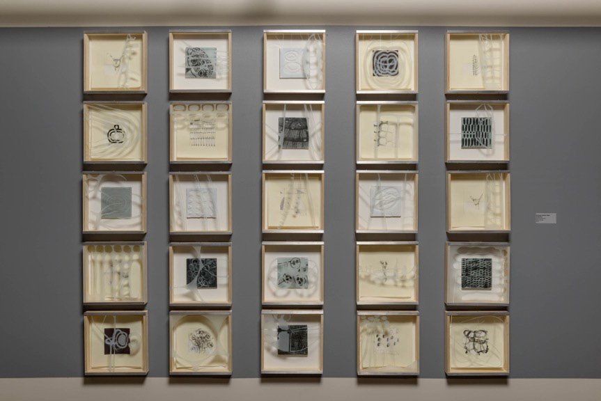 A wall with a lot of pictures on it