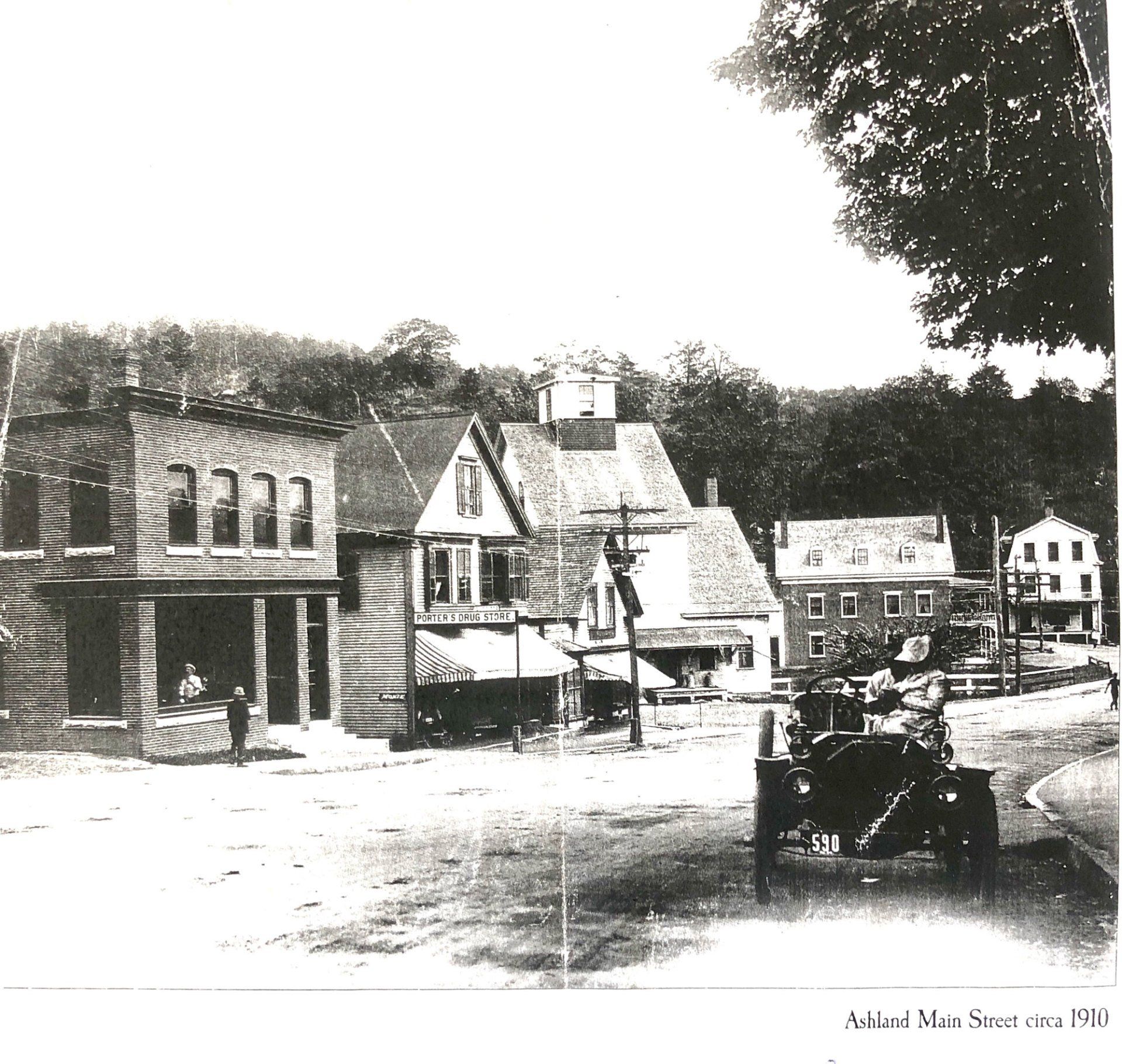 A black and white photo of a small town with the words village view street on the bottom
