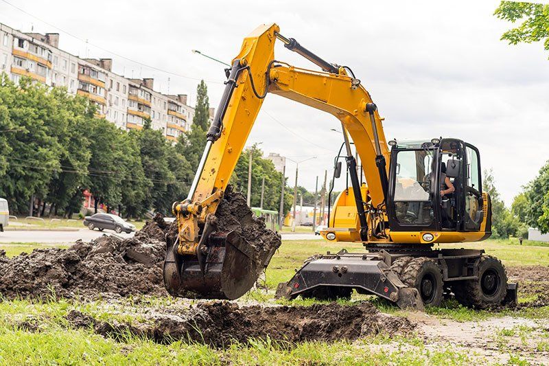 Excavator Digs A Hole — Dempsey Plumbing in Killcare