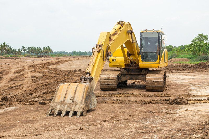 Yellow Excavator — Dempsey Plumbing in Terrigal
