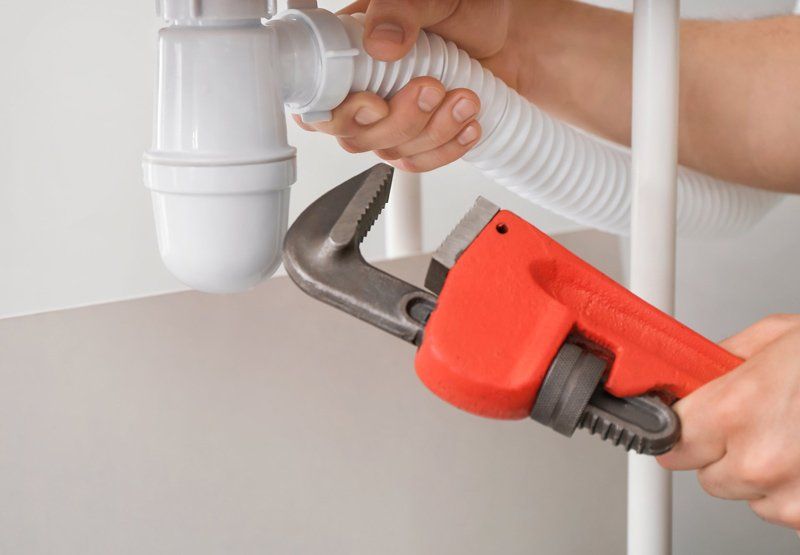 Plumber Repairing Pipes — Dempsey Plumbing in Woy Woy