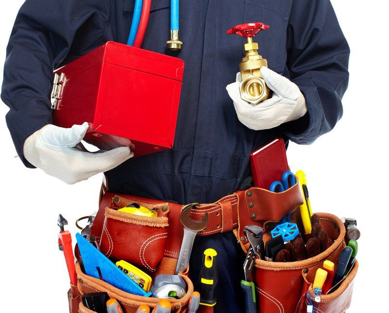 Plumber Hands With Tools — Dempsey Plumbing in Wyong