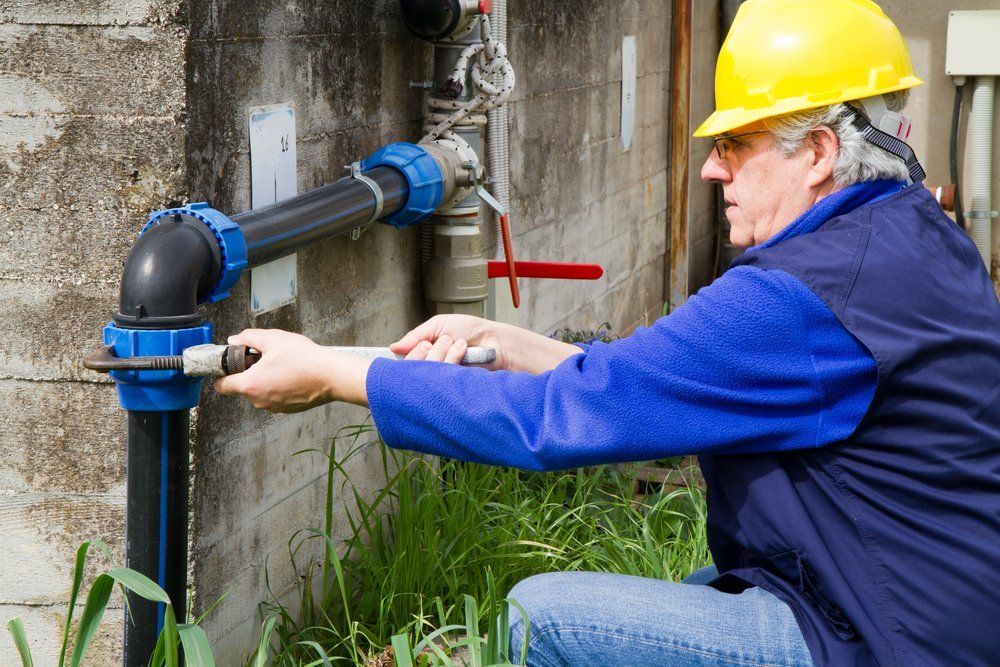 Plumber At Work In Wastewater Treatment Plant — Dempsey Plumbing In Cooranbong