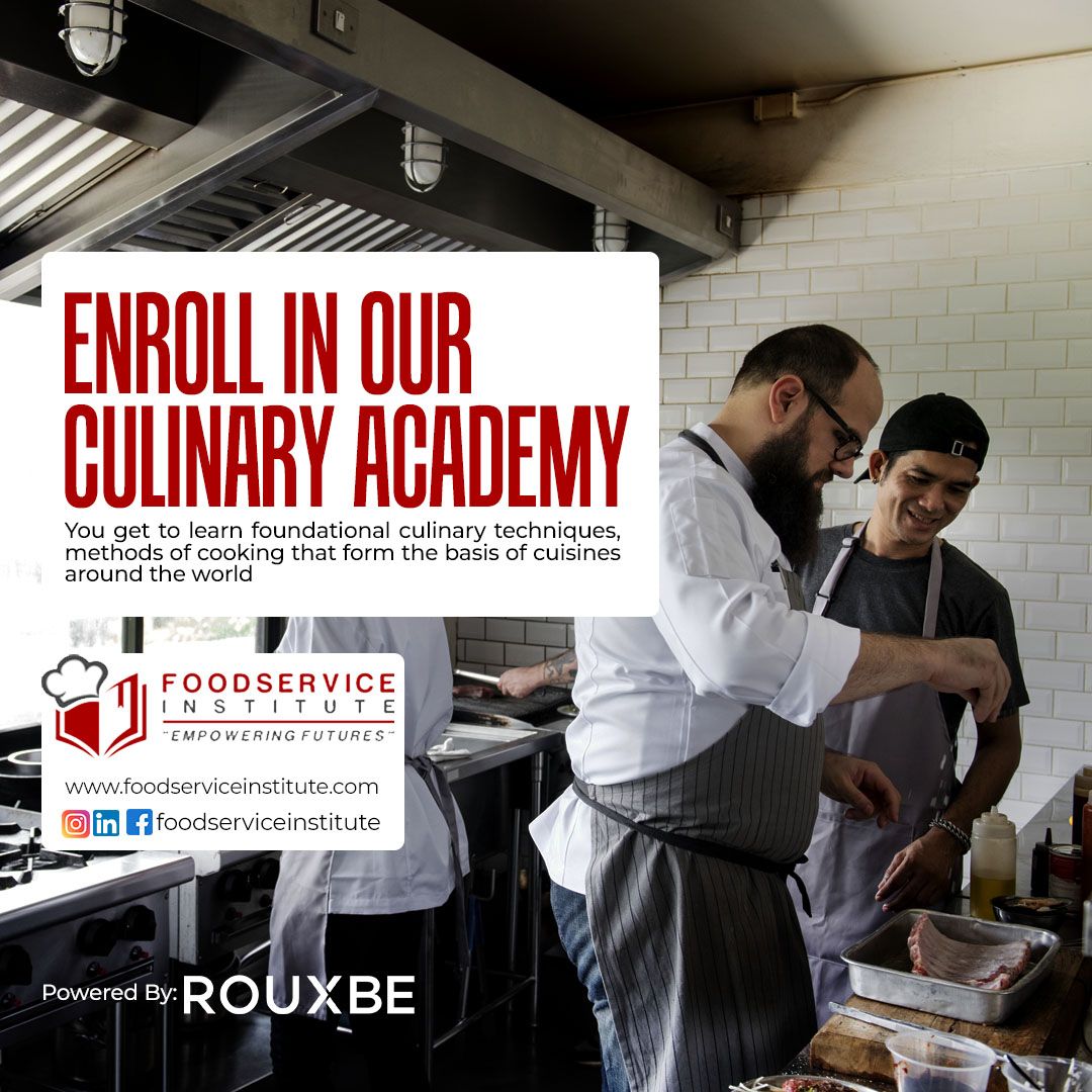 A group of men are cooking in a kitchen with a sign that says enroll in our culinary academy.