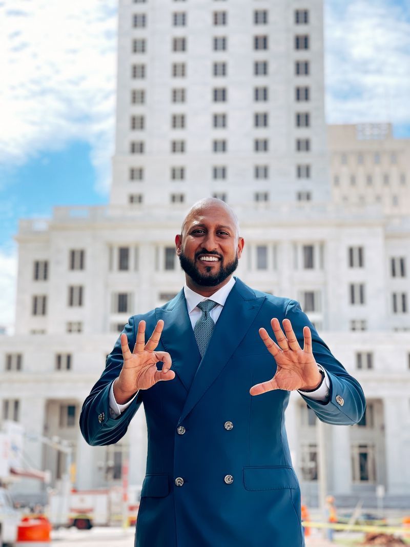 Man in blue suit, making an 