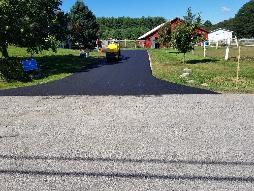 Polishing Asphalt in Driveway — Kennebunk, ME — New England ABC