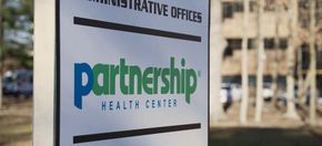 Sign for Partnership Health Center, with