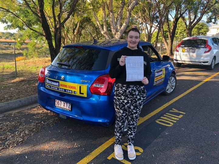 Woman In Black Holding A Certificate — Driving Lessons In Ipswich, QLD