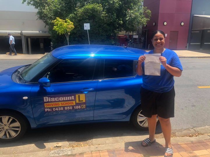 Student In Blue Tshirt Holding A Certificate — Driving Lessons In Ipswich, QLD