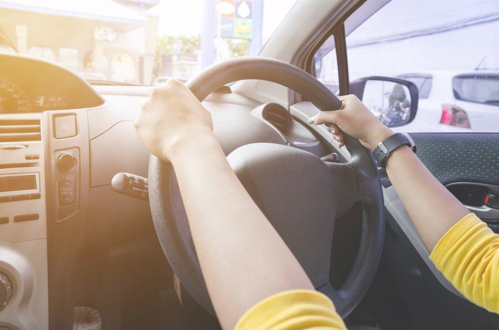 Sunlight Style Picture Of Women Driving The Car — Driving Lessons In Ipswich, QLD