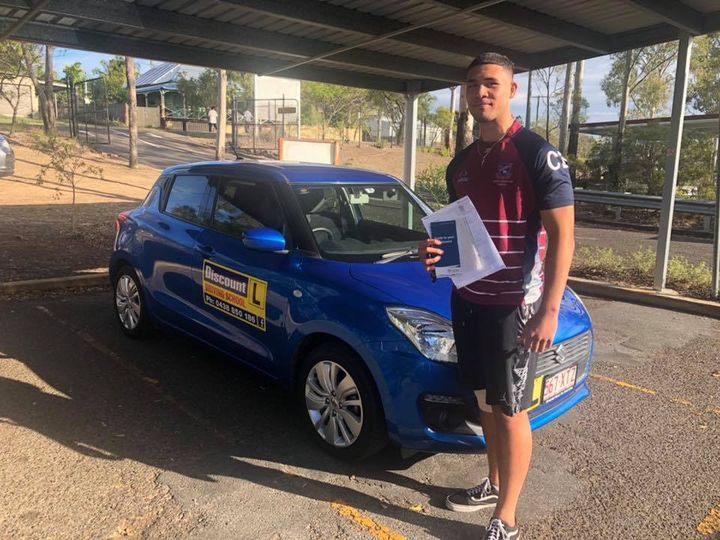 Student Driver Standing Beside The Car — Driving Lessons In Ipswich, QLD