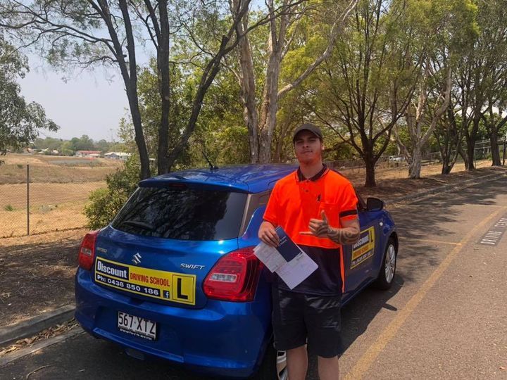 Student Driver Wearing A Orange Tshirt — Driving Lessons In Ipswich, QLD