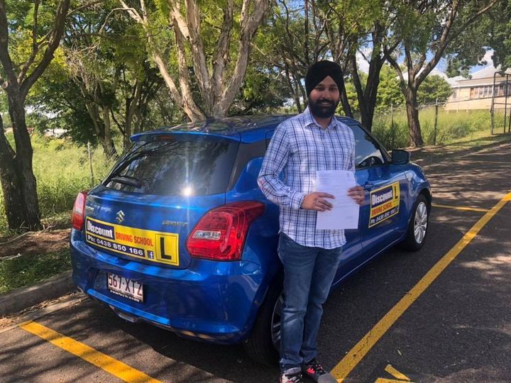 Male Student Driver Holding A Certificate — Driving Lessons In Ipswich, QLD