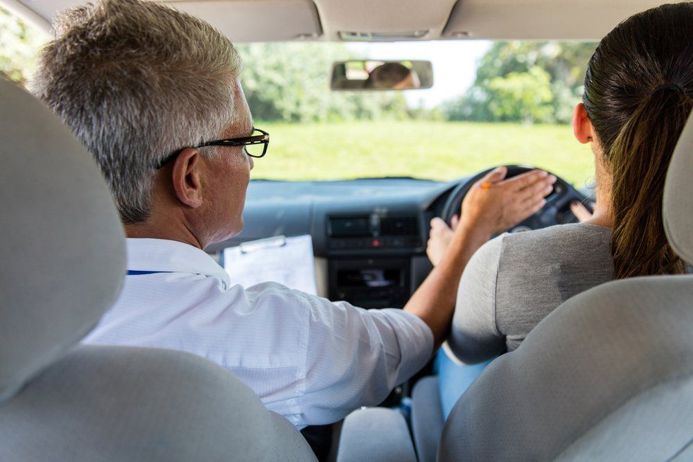 Back View Of Learner Driver With Instructor — Driving Lessons In Ipswich, QLD