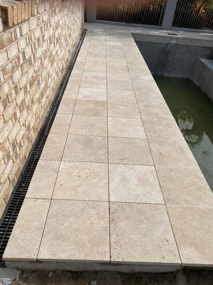Stone Pathway Over Water, Between a Brick Wall and a Pool — Banora Pools in Tweed Heads South, NSW