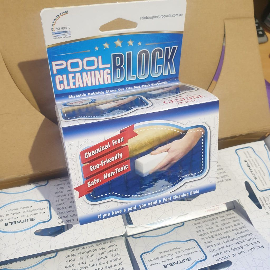 Box of Pool Cleaning Blocks, White and Blue, With Text Pool Cleaning Block and Hand Using Block to Clean Surface — Banora Pools in Murwillumbah, NSW