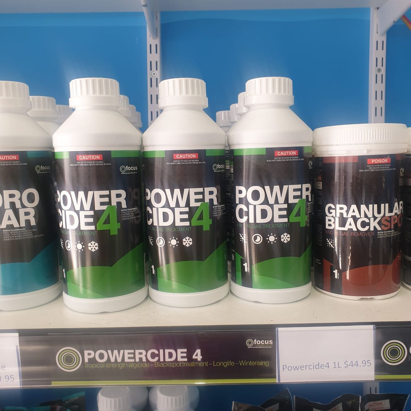 Bottles of Powercide 4 and Granular Black SR on a Shelf in a Store — Banora Pools in Tweed Heads South, NSW