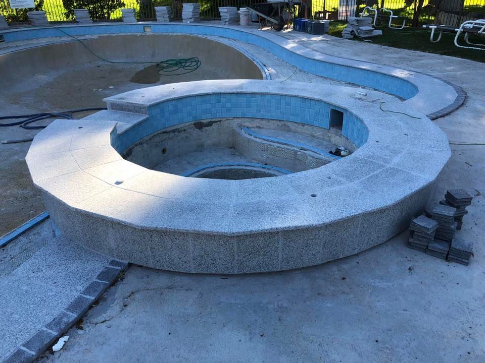 Pool Under Construction, Featuring a Circular Structure With Light Gray Stone — Banora Pools in Currumbin, NSW