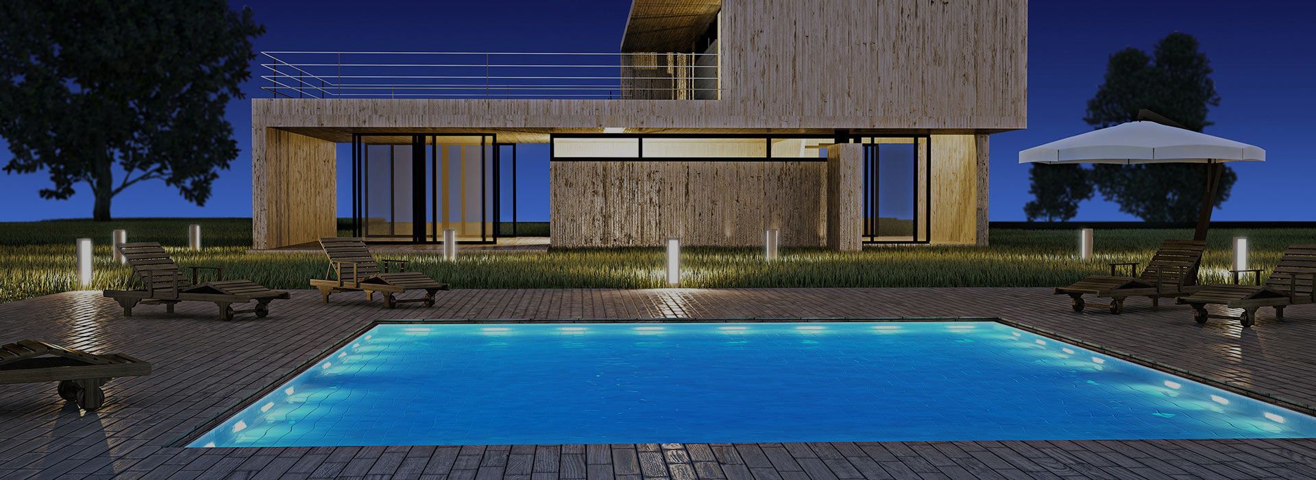 A night scene of a modern house with a pool. The pool has blue lights, and the house is light-colored with a balcony. — Banora Pools in Tweed Heads South, NSW